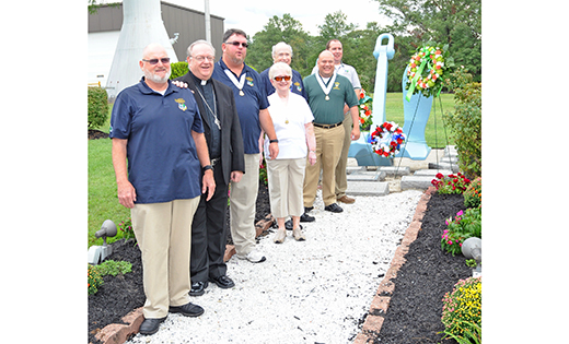 Bishop Dennis Sullivan joins the Ancient Order of Hibernians Division One for a wreath-laying ceremony for the 2015 Barry Day Celebration, Sept. 12, at the Commodore Barry Bridge Plaza in Bridgeport. Born in Ireland, Barry was a devout Catholic and an American Revolutionary War hero.

Photo by Alan M. Dumoff