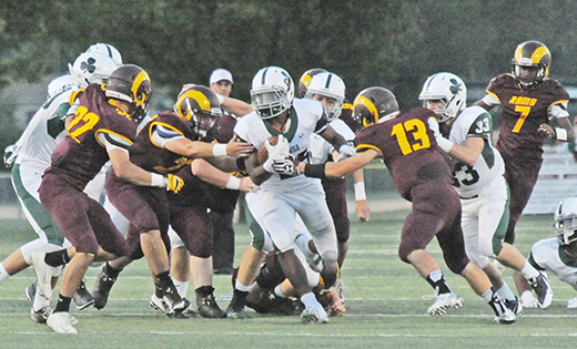 In high school football action, Camden Catholic, Cherry Hill, beat visiting Gloucester Catholic 43-7 in Cherry Hill on Sept. 18. Above, Camden Catholic running back Nazir Streater picks up a first down amidst Gloucester Catholic defenders.

Photo by Alan M. Dumoff