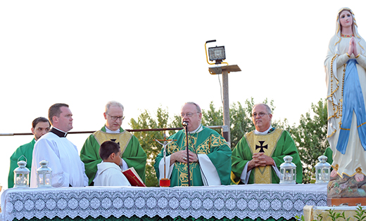 Bishop Dennis Sullivan celebrates Mass at Larchmont Farms in Elmer on Aug. 29. With the bishop at the altar are Father David Rivera, Father Michael Romano, Father Vincent Guest and Deacon Christopher D. Nichols. Not pictured is Father Daniel DiNardo.

Photo by Alan M. Dumoff, ccdphotolibrary.smugmug.com