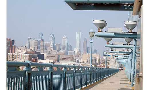 The Philadelphia skyline is visible from the Benjamin Franklin Bridge pedestrian walkway. Many people are expected to walk across the bridge for the papal Mass on Sept. 27.

Photo by Carl Peters