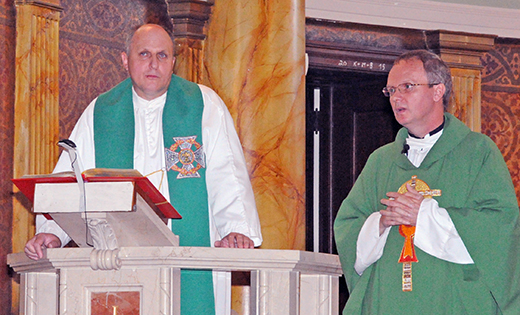 St. Joseph Church in Camden hosted a Mass and presentation on Polish Scouting on Aug. 23, led by Father Pawel W. Kryszkiewicz of St. Joseph, and Father Tomasz, vice rector of the Silesian Seminary, Lad nad Warta, Poland. After a 10:30 a.m. Mass, the two spoke on Polish Scouting and an exchange program between U.S. and Polish Scouts.  Poland Scouting badges and patches were also on display for youth.  Above, Father Tomasz addresses the scouting community as Father Kryszkiewicz looks on.

Photo by Alan M. Dumoff, ccdphotolibrary.smugmug.com