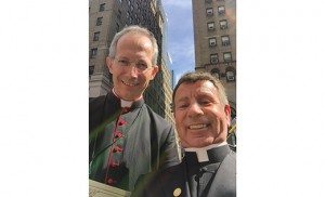 Father Wallace stands with Msgr. Guido Marini, the pope's Master of Ceremonies.