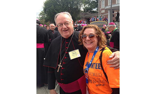 Bishop Dennis Sullivan is pictured at Independence Hall, Philadelphia, with Karen Mallamaci, parishioner of Christ Our Light, Cherry Hill who volunteered for WMOF with her husband, Anthony. Bottom: Kate Deutsch, a student at Camden Catholic High School, Cherry Hill, and her mother, Nancy Falvey Deutsch, attend the papal Mass on Sept 27; Tim and Shireen Dastis of Blackwood, and Dan Moore of Washington Township wore homemade miters to the city on Sept. 26.

Bottom photos by Carl Peters