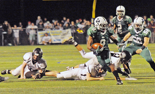 Camden Catholic (Cherry Hill) defeated Bishop Eustace (Pennsauken), 35-0, in high school football on Nov. 6 in Cherry Hill.  Above, Camden Catholic running back Jamal Parker evades defenders on his way to a first down.

Photo by Alan M. Dumoff