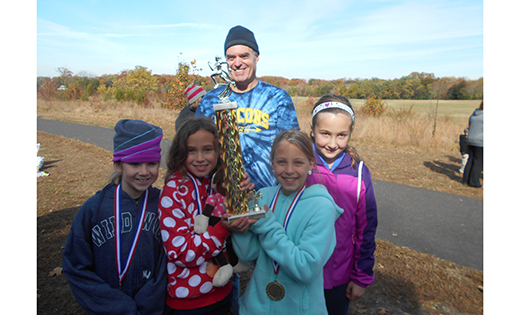 The St. Rose of Lima School, Haddon Heights, girls cross country team finished first in their division. Pictured are Coach Tony Walter, and members of the girls team: Ashley Batejan, Gianna Cicco, Shaelen McNally, and Mia McNally.