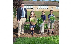 Daniel Biagi, a graduate of St. Mary School, Vineland, and current senior at St. Augustine Prep, Richland, stands with students at St. Mary’s, where he did his service project.
