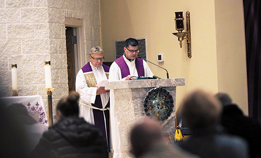 Father Hugh Bradley and Msgr. Joseph DiMauro prepare to speak in front of the faithful at Mary, Mother of Mercy Parish in Glassboro on Dec. 16. They and other diocesan priests led an Advent Penance Service, as did other diocesan churches from Dec. 15-17.

Photo by Mike Walsh