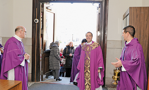 On Dec. 20, Father John Vignone, Dean of the Atlantic County parishes, opened the Holy Door at Saint Nicholas of Tolentine Church, of Saint Monica’s Parish, Atlantic City, to mark the Jubilee Year of Mercy. Above, Father Vignone with Father Nicholas Dudo (left), pastor of Our Lady of Perpetual Help in Galloway, and Father Jon Thomas (right), pastor of Saint Monica. Below, priests and faithful gather outside the church.

Photos by Alan M. Dumoff