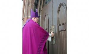 Bishop Dennis Sullivan opens the Holy Door of the Cathedral of the Immaculate Conception, Camden, on Dec. 8. Photo by James A. McBride