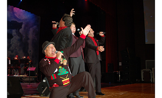 Comedian Jim Labriola, kneeling, joins the New York Tenors onstage at Investors Bank Performing Arts Center in Sewell Dec. 5. The Magic of Christmas concert benefited Catholic school students, with the money raised going to the South Jersey Scholarship Fund.

Photo by James A. McBride