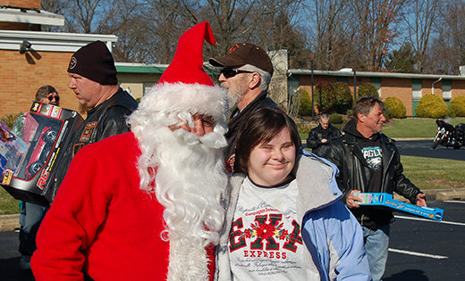 On Dec. 5 jolly old Saint Nicholas visited clients at Saint John of God Community Services in Westville Grove, which provides educational, therapeutic and vocational programs for individuals with disabilities. The seasonal personality’s visit coincided with the POW-MIA Awareness Motorcycle Club’s 12th Annual Toy Run. Members of the club hand-delivered toys and gifts. With St. Nick is Miranda Cheverie.

Photo by James A. McBride