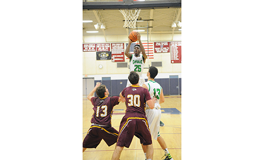 On Dec. 30, Camden Catholic, Cherry Hill, bested Gloucester Catholic, 52-39, in a high school mens’ basketball Holiday Showcase game at Eastern High School in Voorhees. Above, Camden Catholic’s Baba Ajike goes up for a shot.

Photo by Alan M. Dumoff