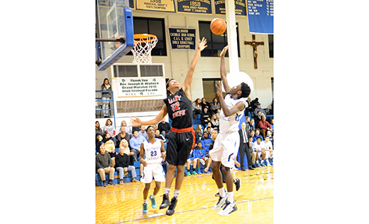 On Jan. 6, Wildwood Catholic defeated visiting Saint Joseph’s (Hammonton), 83-60, in high school boys’ basketball. Above, Crusader Jalen Freeman scores over Wildcat Najee George.

Photo by Alan M. Dumoff, http://ccdphotolibrary.smugmug.com
