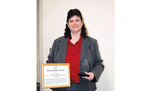 Kate Slosar, Co-Director, Ministry With the Deaf, Diocese of Camden, holds the Humanitarian Award she received at the New Jersey Association for the Deaf/New Jersey Registry of Interpreters Conference held in November 2015. Photo by James A. McBride