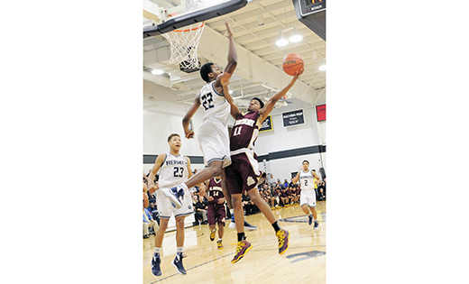 The Saint Augustine Hermits boys’ basketball team lost to visiting, nationally-ranked Saint Anthony last Saturday in Richland. In a Shoot Down Cancer Classic game, the Hermits fell to the Friars 52-39. Above, the Hermits’ Justyn Mutts blocks the shot of Shayquan Gibbs.

Photo by Alan M. Dumoff, more photos ccdphotolibrary.smugmug.com