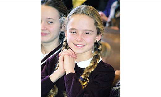 Grace Malcarney, a fifth grade student at Christ the King School, Haddonfield, attends Mass  to begin Catholic Schools Week Jan. 31 at Christ the King Church. Bishop Dennis Sullivan was the celebrant.

Photo by Cynthia Soper