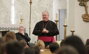 Bishop Dennis Sullivan talks to students of Bishop Schad Regional School during a prayer service at Sacred Heart Church in Vineland on Feb. 2. Also pictured is Msgr. John H. Burton, pastor of Christ the Good Shepherd Parish, where both the church and school are located. Photo by Mike Walsh
