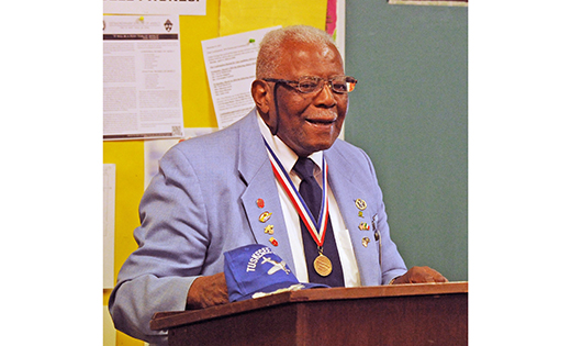 Dr. Eugene J. Richardson, one of the Tuskegee Airmen during World War II, shared his story and history of the African-American aviators with visitors to Holy Eucharist Church in Cherry Hill on Feb. 5. The Tuskegee Airmen were the first African-American military aviators in the U.S. armed forces. Richardson spoke of how the military was racially segregated as was much of the U.S. federal government and how the airmen were subjected to racial discrimination, both within and outside the army.  Overcoming these adversities, they flew with distinction. The Tuskegee 332nd Fighter Group saw action in Operation Torch, in Sicily, and were deployed as bomber escorts in Europe.

Photo by Alan M. Dumoff