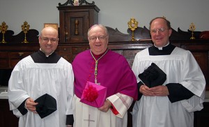 Bishop Dennis Sullivan stands with John Rotondi, left, who he called to the ministry of acolyte, and Father Robert C. Pasley, rector of Mater Ecclesiae in Berlin. Photo by James A. McBride