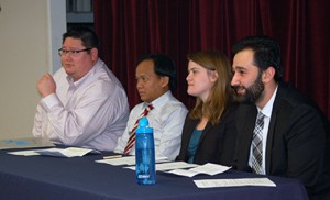 From left: Patrick Barry, director of Catholic Charities’ Refugee Program; case manager Francis Kap Lian; Caitlin Jones, coordinator of Refugee Services; and case manager Moustafa Aldouri were panelists at Christ Our Light’s “Welcoming the Stranger” evening on Jan. 28. Photo by James A. McBride