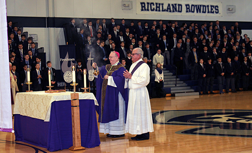 Bishop Dennis Sullivan celebrates Mass with Father Donald F. Reilly, OSA, president of Saint Augustine Preparatory School, Richland, during a Feb. 24 visit to the school.