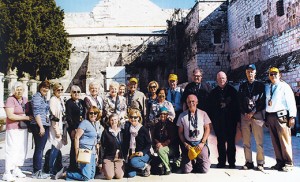 Father Robert Hughes, vicar general of the Diocese of Camden, third from right, and pilgrims from the Diocese of Camden pose for a photo in Bethlehem during a recent pilgrimage to the Holy Land. Photo by Nadir Abu-Dayyeh