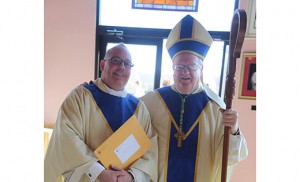 Bishop Dennis Sullivan stands with Father Christopher Mann, parochial vicar at Infant Jesus Parish, Woodbury Heights, who was incardinated into the Diocese of Camden at the Chrism Mass March 22 in Saint Agnes Church, Our Lady of Hope Parish, Blackwood. Incardination is the term for a priest being attached to his diocese, or religious institute or society.