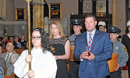 Jen and Albert Mallen, survivors of Albert J. Mallen, Sr., NJSP, bring the offertory gifts to the altar during the 31st annual memorial Mass honoring public safety personnel who died in the line of duty. Father Jon Thomas, pastor, celebrated the Mass March 13 at Saint Nicholas of Tolentine Church, Saint Monica Parish, Atlantic City. It was sponsored by the 200 Club of Atlantic and Cape May counties, a non-profit organization dedicated to providing financial support for the families of police, fire and rescue personnel who have risked and lost their lives in the line of duty.

Photo by Alan M. Dumoff, more photos  ccdphotolibrary.smugmug.com