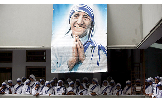 A poster of Blessed Teresa of Kolkata and Missionaries of Charity are seen in Kolkata, India, in this Sept. 5, 2007, file photo. Pope Francis will declare her a saint at the Vatican Sept. 4, the conclusion of the Year of Mercy jubilee for those engaged in works of mercy.

CNS photo/Jayanta Shaw, Reuters