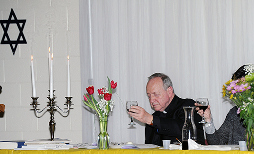 Father Mark Cavagnaro, pastor, holds up his wine glass and recites the Kiddush Prayer during a Seder at Our Lady of Hope Parish, Blackwood, on March 23.

Photo by Alan M. Dumoff, more photos ccdphotolibrary.smugmug.com