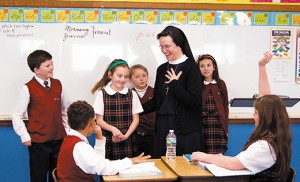 Sister Patricia Scanlon, IHM, talks to fourth grade students at Saint Teresa Regional School, Runnemede, where she has served as principal for eight years. In addition to education, women religious in the Diocese of Camden are involved in health care, social services, religious education and spiritual direction. Some 236 sisters, representing 27 communities, serve in the diocese. Photo by James A. McBride