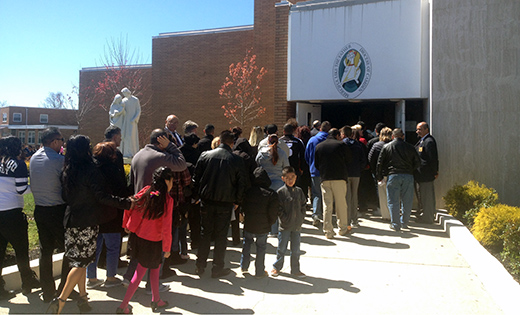 Worshippers gather at the Holy Door at Divine Mercy Parish, Vineland.