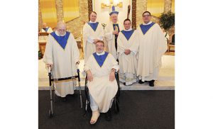 Beside Bishop Sullivan, celebrating 40 years of the priesthood, are, from left, Father Glenn Hartman, Father Anthony Manuppella and Father John Bruni. In front are Father Robert McDade, M.SS.CC., and Father Paul Harte. Not pictured: Father Anthony DiBardino and Father Michael Orsi. Photos by Alan M. Dumoff