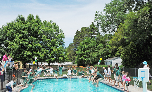 Wearing their uniforms, students of Bishop McHugh Regional School, Cape May Court House, dive into the McMahon family swimming pool at their Ocean View home. The end of the year in-uniform dive and swimming party afterward (with swimsuits) at the McMahon residence has become an annual tradition for Bishop McHugh
students.

Photo by Alan M. Dumoff, more photos, ccdphotolibrary.smugmug.com