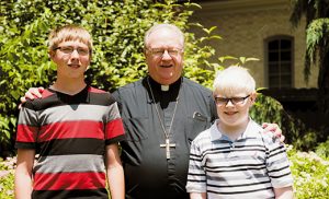 Mark Szafran and Kyle Delessio were the top two faithraisers at this year’s iRace4Vocations event. Together with the other participants at iRace4Vocations, over 98,000 prayers for vocations were raised. They had lunch at the Bishop’s residence on June 22. Photo by John Kalitz
