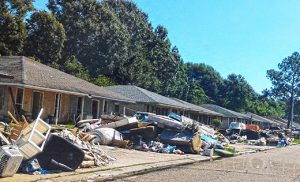 Debris is seen in front of flood-damaged homes after historic flooding in Louisiana 