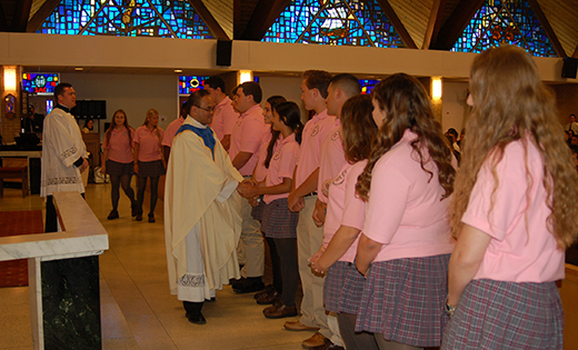 Bishop Dennis Sullivan installed Father Allain Caparas as president/principal of Saint Joseph High School at a school Mass in Hammonton on Sept. 12. Above, Father Caparas greets student council members during the installation. Below, Bishop Sullivan with students of the executive board: Olivia Craig, secretary; Michael Mascioli, treasurer; J.D. DiRenzo, president; and Elijah Hardee, vice president.

Photos by James A. McBride