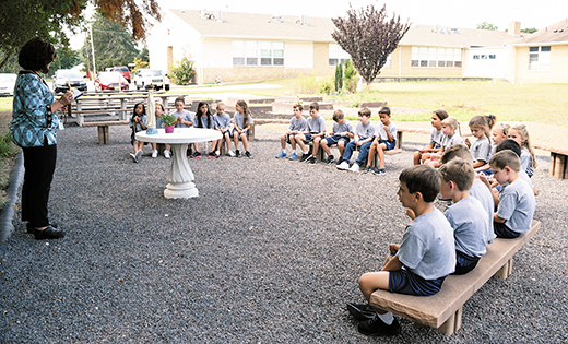 Second grade students pray the rosary in the outdoor classroom at Saint Mary School, Vineland.