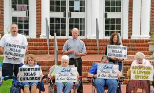 Deacon James J. Hallman and other pro-lifers participate in a life chain in front of Saint Mary Church, Our Lady of Peace Parish, Williamstown, on Oct. 2. Life Chains were held in all six counties of the Diocese of Camden. Photo by Alan M. Dumoff, more photos ccdphotolibrary.smugmug.com