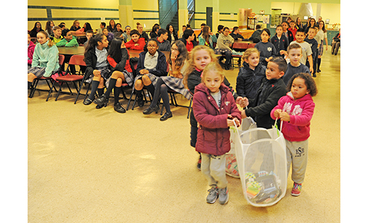 Last month, students of Vineland’s Bishop Schad Regional School brought warmth to their homeless neighbors, donating socks to the Cumberland County Code Blue Coalition. During the frigid winter months, the organization runs “warming centers” where the needy can find emergency shelter and a warm meal. Above, after a presentation on the program, students bring up donations.