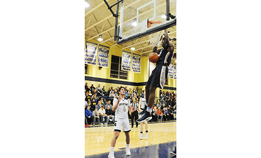 In high school boys’ basketball, the visitors of Saint Augustine (Richland) beat Holy Spirit 45-22 in Absecon on Jan. 9. Above, Justyn Mutts hangs onto the rim after dunking one in for 2  for the victorious Hermits.

Photo by Alan M. Dumoff