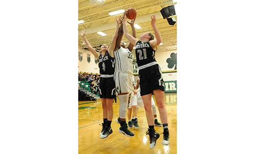 On Dec. 22 in high school girls’ basketball, Camden Catholic defeated visiting Pennsauken’s Bishop Eustace, 56-40, in Cherry Hill. Above, the Irish’s Brittany Gardner (33) fights for the ball with the Crusaders’ Jen Falconiero and Meghan McLaughlin. That same night, Camden Catholic honored the school’s 1981 South Jersey girls’ basketball champions (below). Pictured are, kneeling, Deirdre Kane (Coach '81) and Mary Jo Bergbauer Nichols. Standing: Coach Christine Palladino, Virginia Onofrio, Jeanette Persiano, Diana DeJesus Brent, Beth Wagner Coyne, Don Monforto (former assistant coach) and Hellena DeLarge.