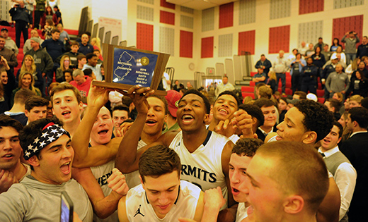 Photo by Alan M. Dumoff

Jubilant Hermits hoist their trophy high after capturing the Non-Public A South Championship last week against Bishop Eustace