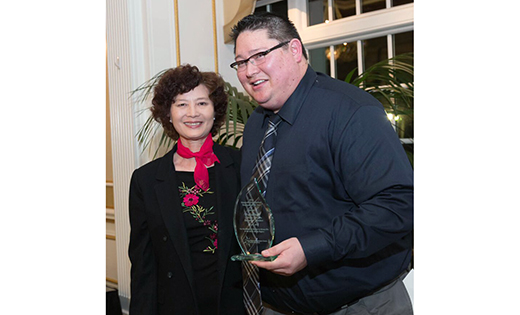 Patrick Barry poses with his mother, a refugee who fled the Khmer Rouge regime in the 1970s, after receiving the Employee of the Year award from the Nonprofit Development Center of Southern New Jersey for his outstanding work as Director of Refugee and Immigration Services at Catholic Charities, Diocese of Camden.

By Mary McCusker