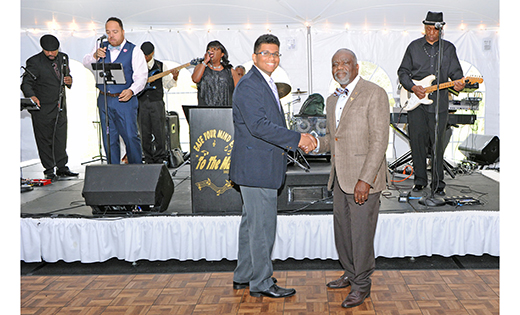 James E. Andrews, director of Black Catholic Ministries, Diocese of Camden, congratulates Sajan Young, one of three recipients this year of a Black Catholic Ministry Commission Scholarship, during the Afternoon of Jazz fundraiser April 23 at Masso’s Crystal Manor in Glassboro. Right, Sajan with Olympic high jumper Priscilla Frederick, a 2003 scholarship recipient.

Top photo by Alan M. Dumoff
