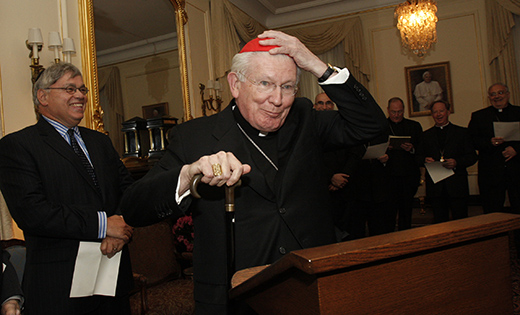 Cardinal William H. Keeler, retired archbishop of Baltimore, places a zucchetto on his head as he prepares to offer the opening prayer during a prayer service for Catholic and Jewish leaders hosted by New York Archbishop Timothy M. Dolan at his residence in New York May 12, 2009. Cardinal Keeler died March 23. He was 86.

CNS photo/Gregory A. Shemitz