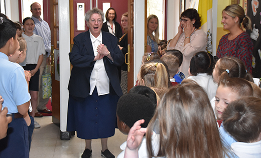 Walking back into the school after morning Mass on April 25, Sister Patrick Maureen Darcy, IHM was surprised by students and staff of Saint Teresa School, Runnemede, wishing her a happy 80th birthday and 60th jubilee as a Sister of the Immaculate Heart of Mary. Runnemede Mayor Nick Kappatos issued a proclamation declaring April 25 Sister Patrick Maureen Darcy Day, and students presented the beloved religious with flowers and cards. For the past three years, Sister Patrick has taught religious enrichment to students in first to fourth grades.

Photo by James A. McBride