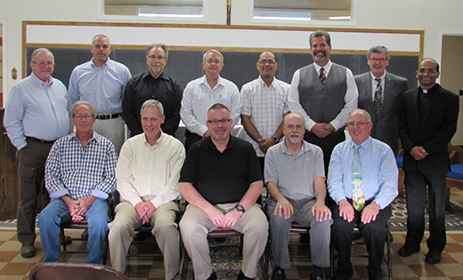 A dozen men, both deacons and those in formation, recently completed training in Stephen Ministry. Pictured are, back row from left, Deacon James Rocks; candidate Joseph Farro; candidate Anthony Petillo; Deacon Steve Theis; candidate Pedro Espinal; candidate Michael Bortnowski; Deacon Michael Carter, director of formation for the Office of the Diaconate; and Father Sanjai Devis, director of Stephen Ministry. Front row from left: Deacon Joseph Beebe; candidate Bill Brewer; candidate Joseph Coley; Deacon Frank Cerullo and Deacon Chris Nichols. Not pictured, Deacon John Contino.