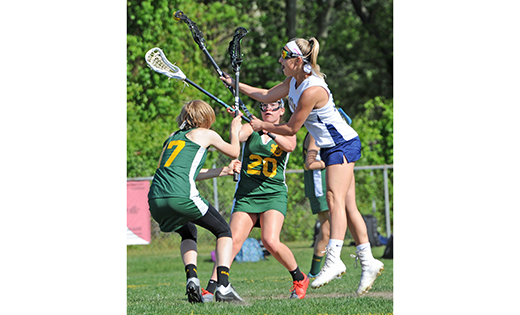 On May 16, Holy Spirit High School defeated visiting Our Lady of Mercy Academy (Newfield) 11-3 in Absecon. Above, the two teams fight for possession.

Photo by Alan M. Dumoff