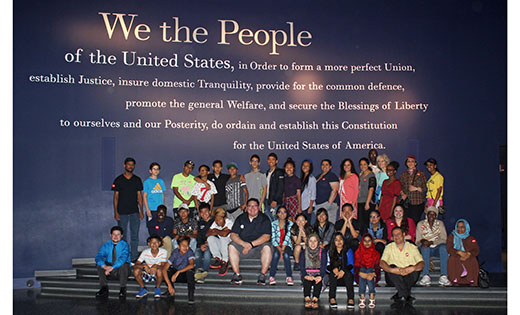 Refugee clients and staff of Catholic Charities, Diocese of Camden, pose for a photo at the Constitution Center in Philadelphia on June 10. The group spent the day learning about American history and culture.
Photo by Mary McCusker